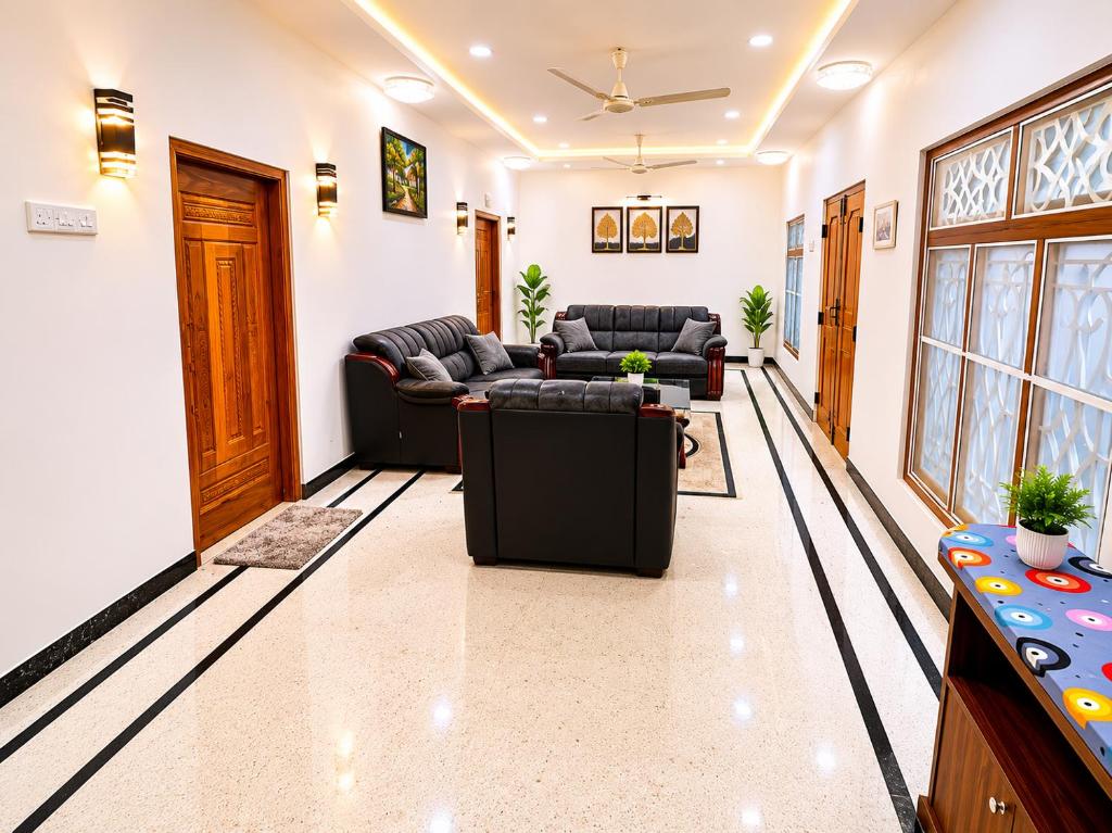 a living room with a couch and a table at DNN Brothers Villa in Jaffna