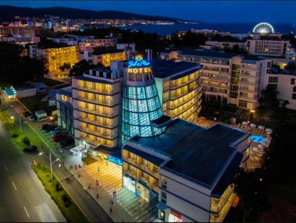 a lit up building in a city at night at Dream 3 in Sunny Beach