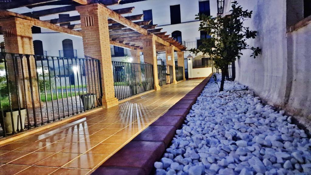 a building with a bunch of rocks on the ground at Velez Nazari 2 in Vélez de Benaudalla