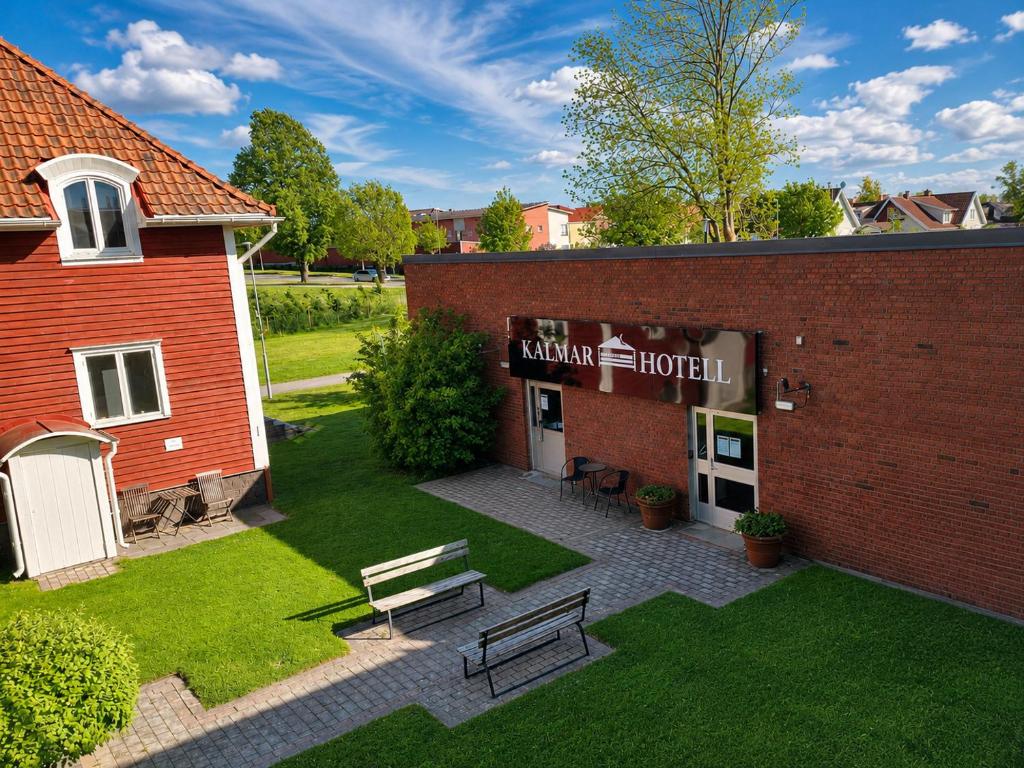 a building with a bench in front of it at Kalmar Hotell in Kalmar