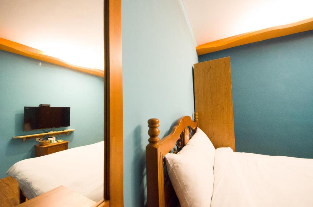 Postel nebo postele na pokoji v ubytování Baisha 31 B&B