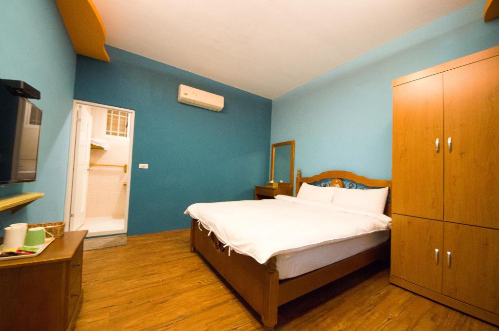 Postel nebo postele na pokoji v ubytování Baisha 31 B&B