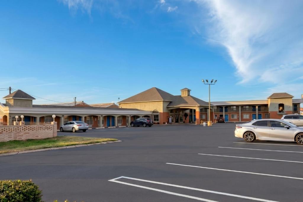 a parking lot in front of a motel at Aloha Inn McAllen Airport near Medical center Tx in McAllen