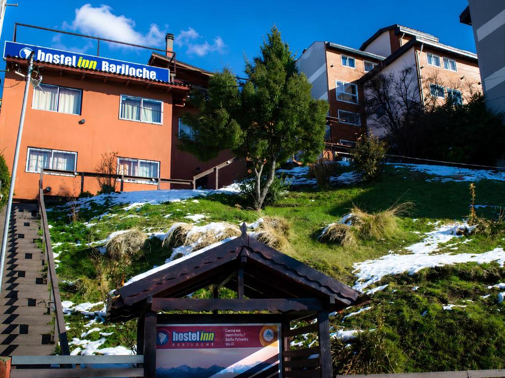 a building with a sign that reads fusion inn berlin at Hostel Inn Bariloche in San Carlos de Bariloche