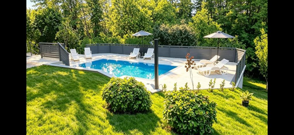 a pool with chairs and an umbrella in a yard at Vikendica Sana in Sanski most