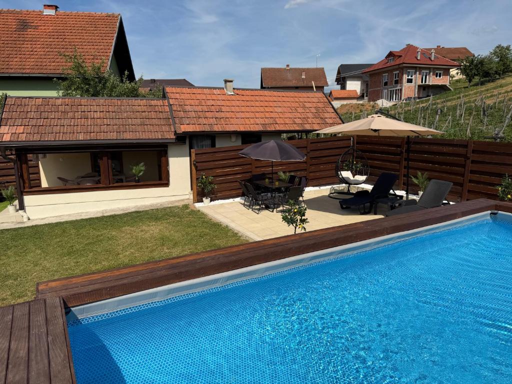 a swimming pool in the yard of a house at Vila Jovanovic in Bajina Bašta