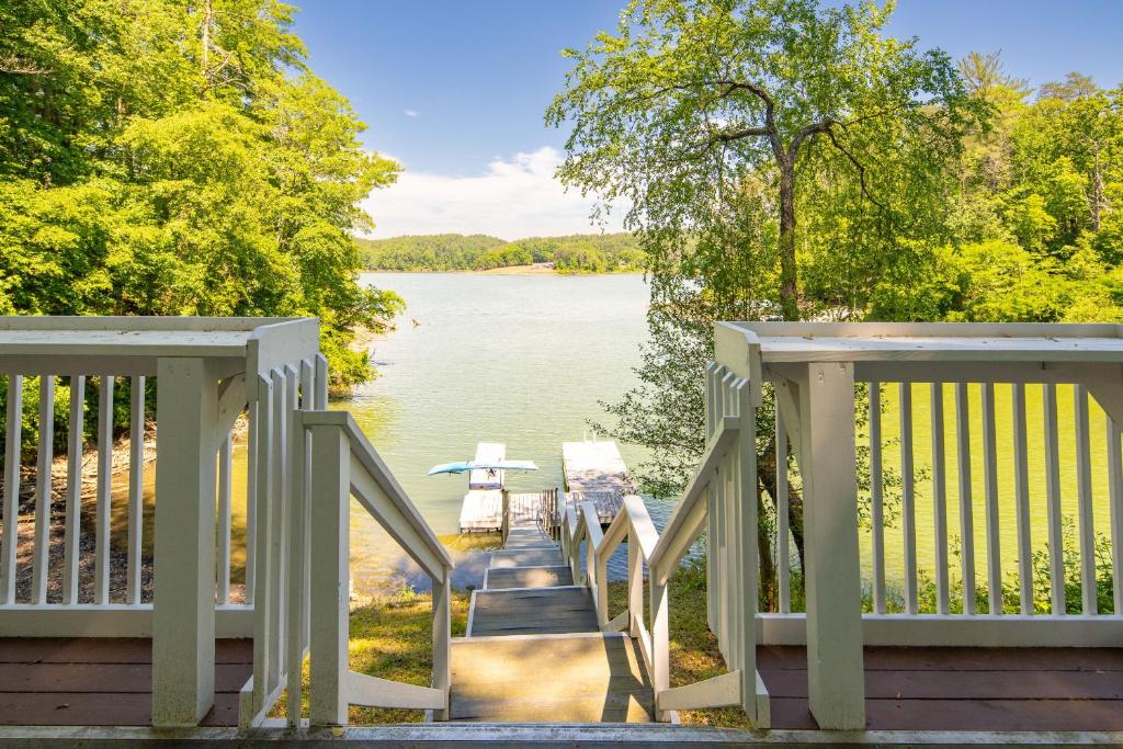 a stairway leading down to a lake from a house at Bella Di Lago in Wilkesboro
