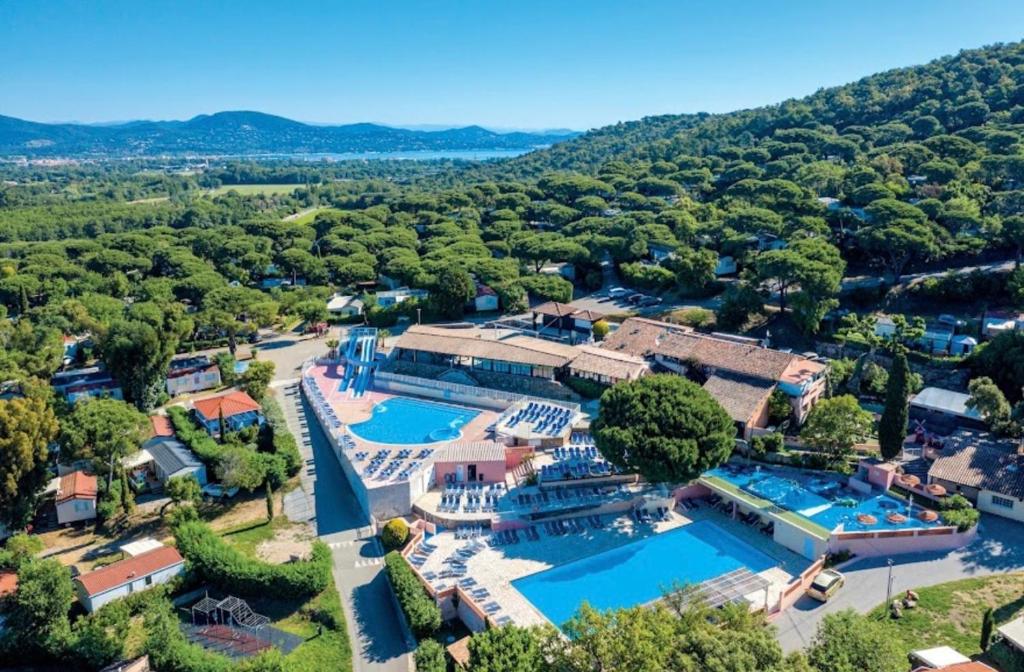 an aerial view of a resort with two swimming pools at Parc Montana - Mobile home in Gassin