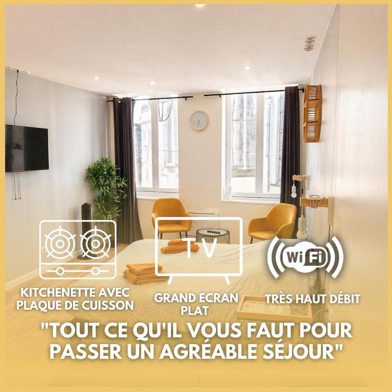 a living room with a table and chairs in a room at Studio tout équipé calme et lumineux Roubaix in Roubaix
