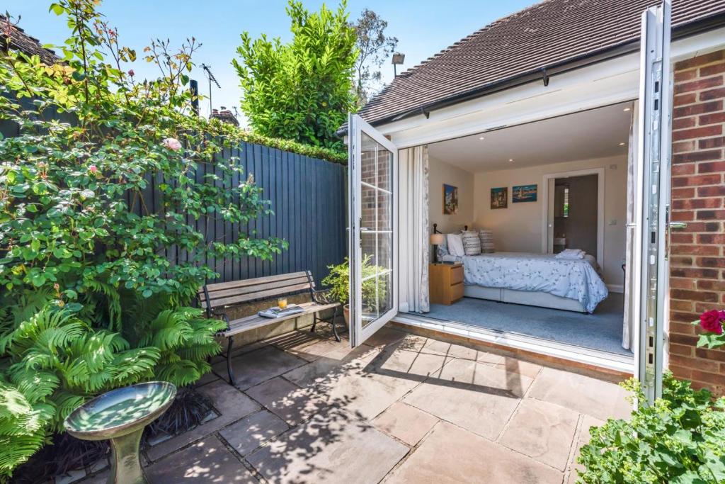 a garden room with a bed and a patio at 1 Bed in Wadhurst oc-79495 in Ticehurst