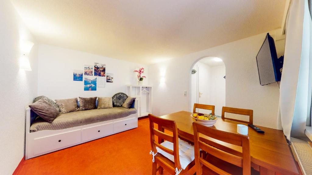 a living room with a couch and a table at Wohnhaus Christoph in Längenfeld