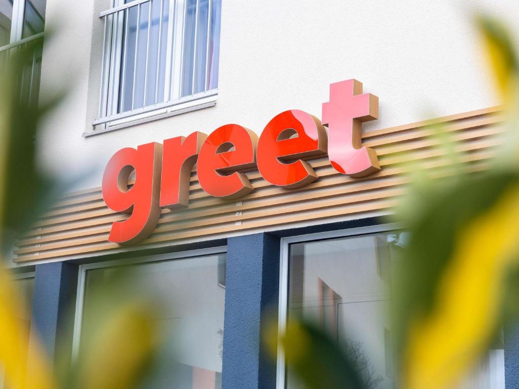 a store sign on the side of a store at greet Hotel Nancy Sud in Houdemont