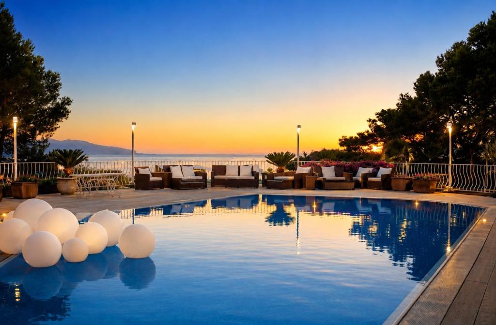 a pool with white balls on top of it at La Canostra Capri - luxury ROOM ad Anacapri in Anacapri