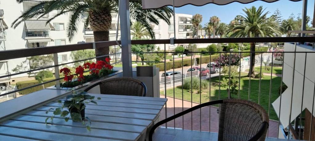 a balcony with a table and chairs and a view of a street at Formentor Inn in Salou