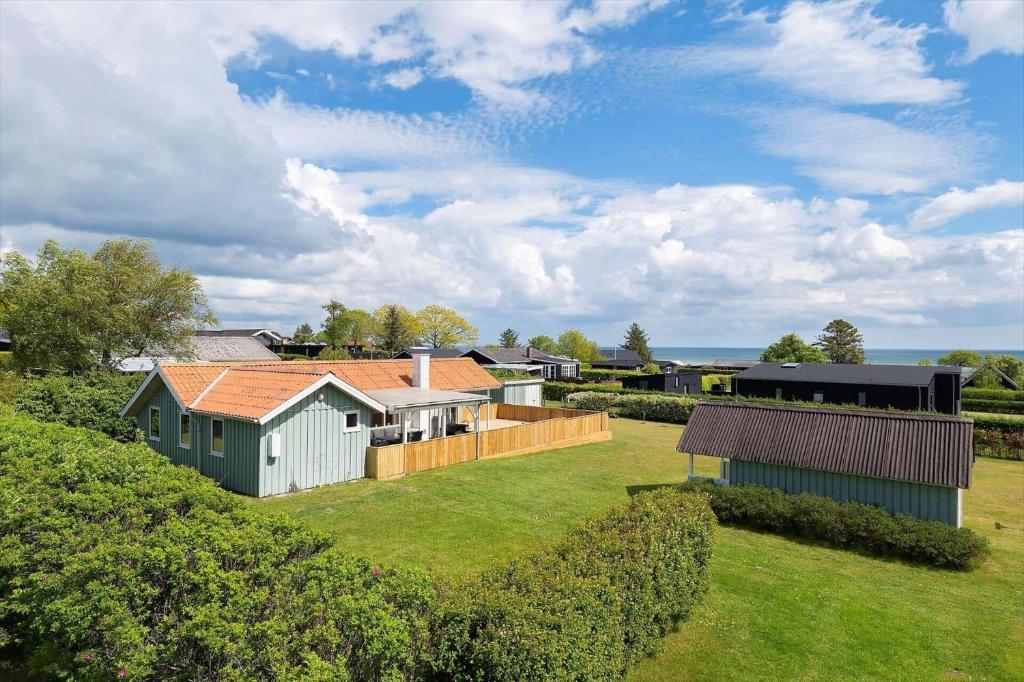 an aerial view of a house with a yard at OH592-Hadsund-Haslevgaarde-Bakker-12 in Øster Hurup
