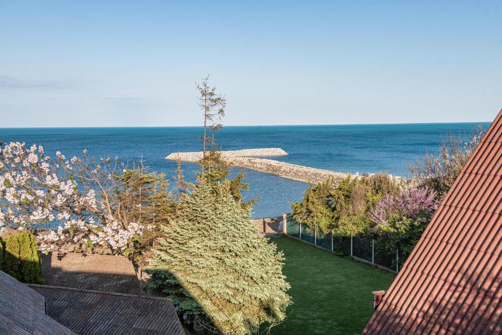 une vue de l'océan depuis une maison dans l'établissement Vila Victory, à 2 Mai