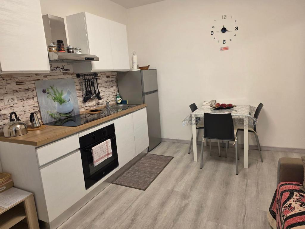 a kitchen with a table and a dining room at Nido Ticino in Bernate Ticino