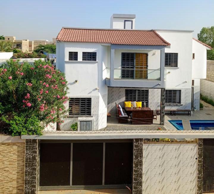 a view of a white house with a yard at Villa Bamba TERANGA in Somone