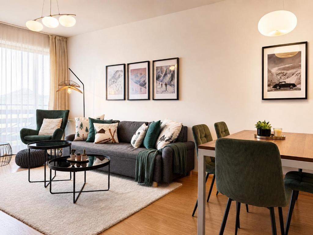 a living room with a couch and a table at Ski IN-OUT Apartmán Donovaly in Donovaly