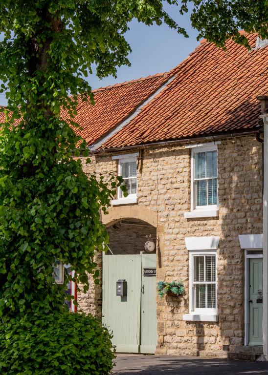 an old stone house with a green door at Platform 17 in Pickering