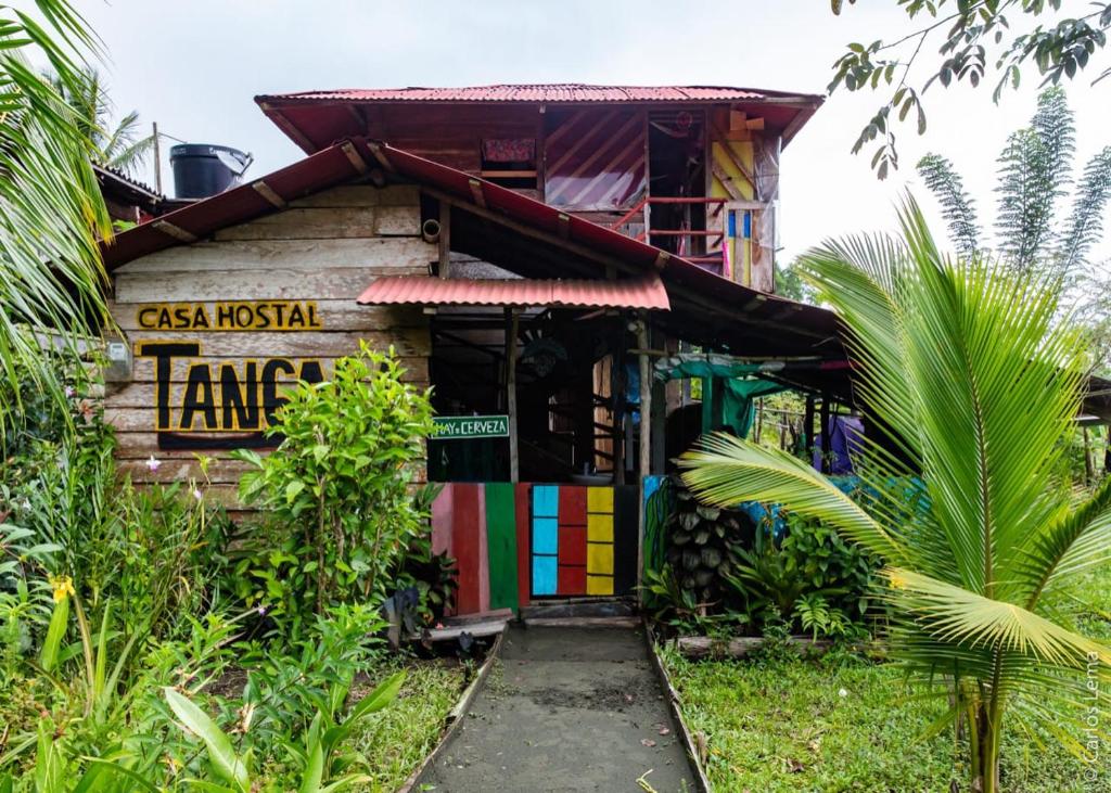 a small house with a colorful front door at TANGARA Hostel in Buenaventura