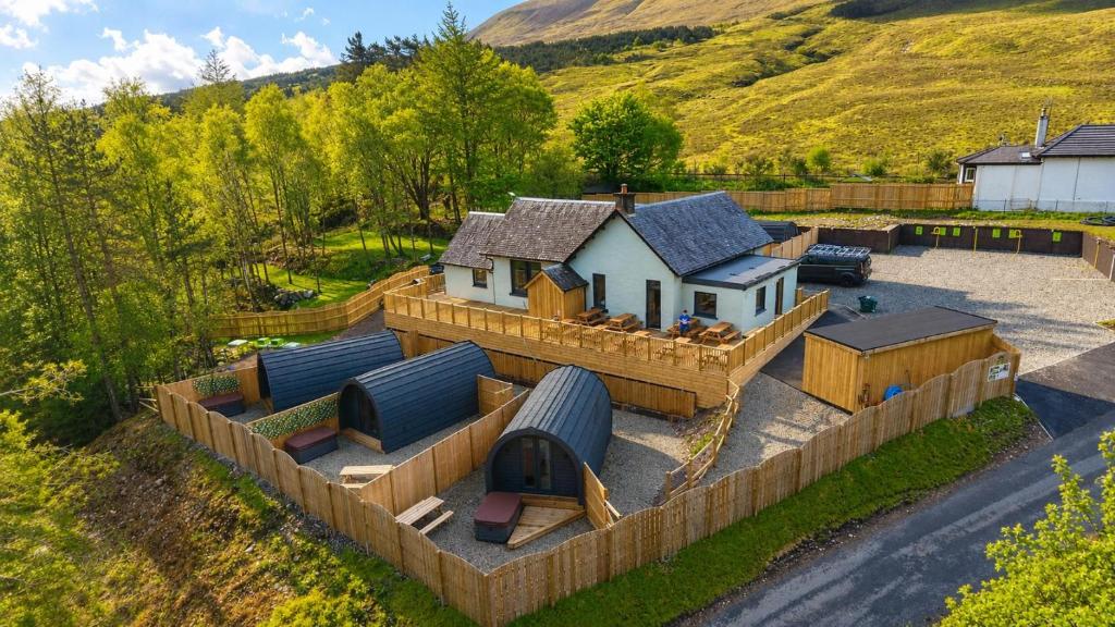 an aerial view of a house with a playground at 60 Mile Inn - Luxury Pods with Hot Tubs in Bridge of Orchy
