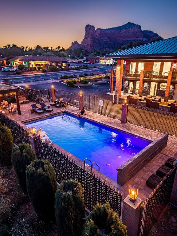 a large swimming pool in front of a hotel at Kokopelli Inn Sedona, Trademark Collection by Wyndham in Sedona