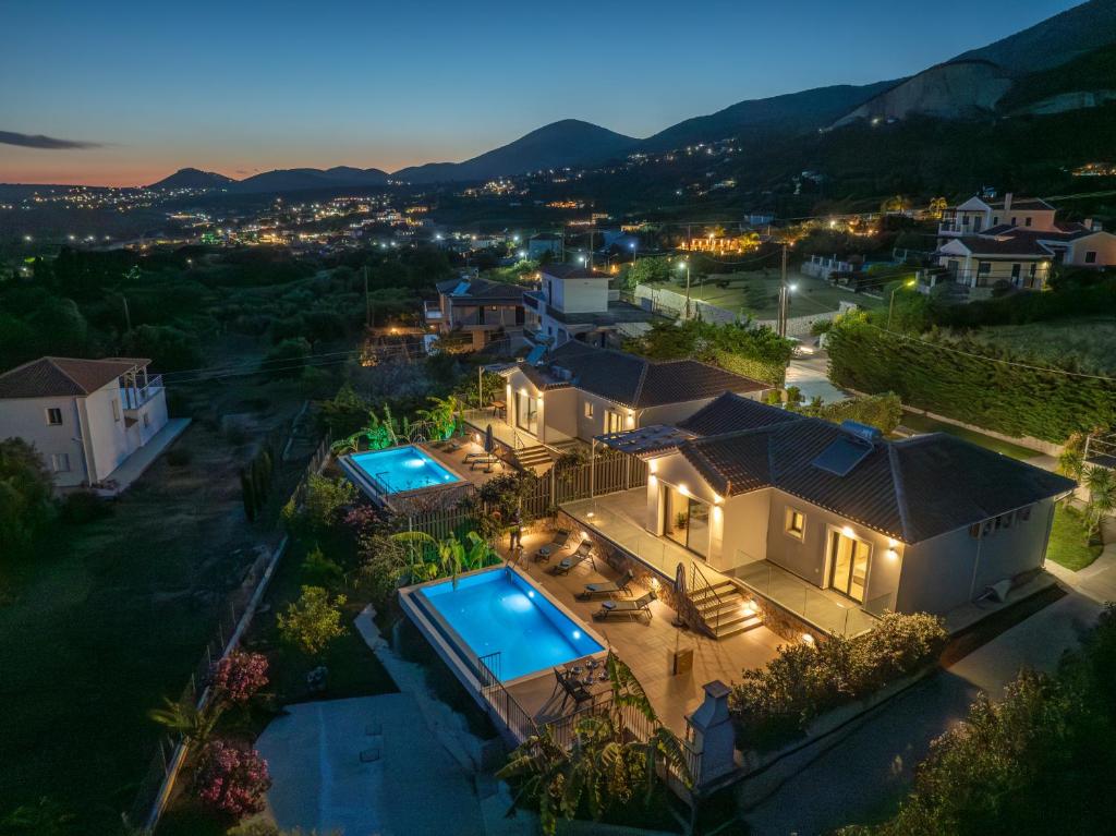 an aerial view of a house with a swimming pool at Vista Blu Villas in Vlachata