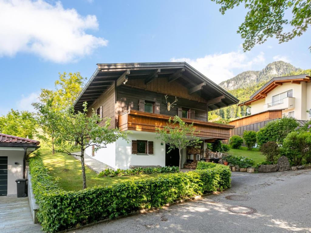 a house in the mountains with a driveway at Amberg in Schwoich