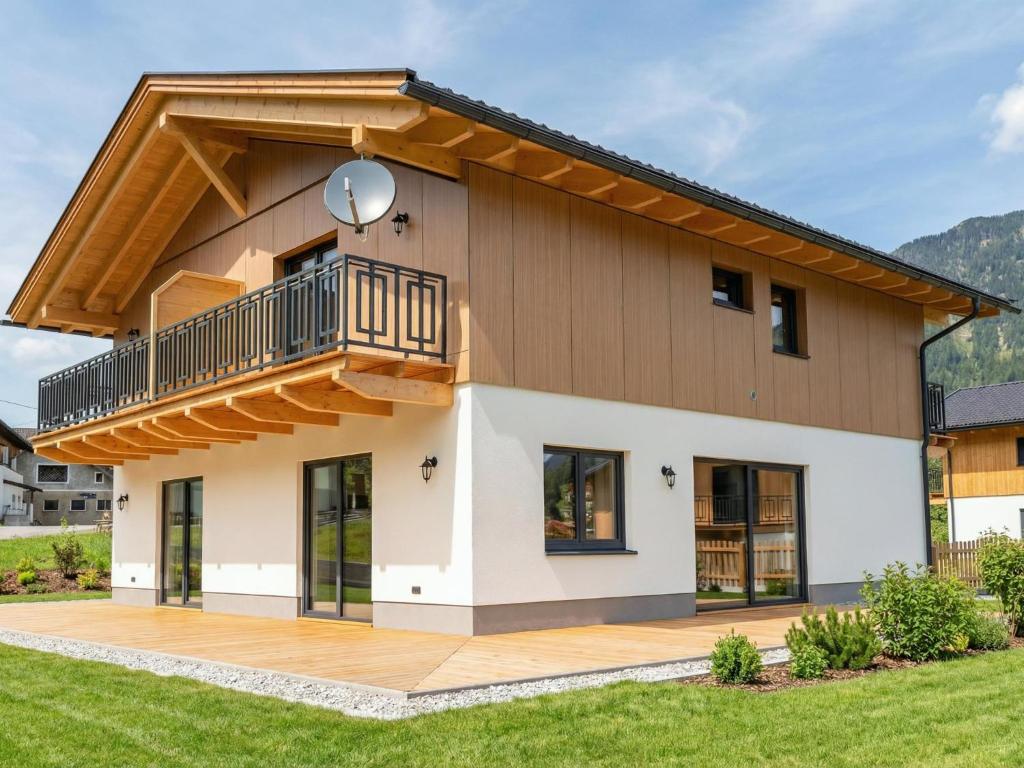 a house with a balcony on top of it at Obermöschach 1 in Lake Pressegg