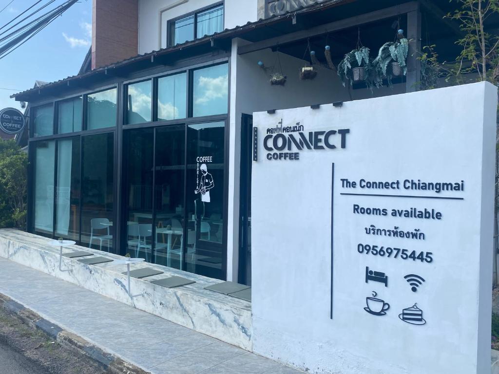 a building with a sign in front of it at The Connect Chiang Mai in Chiang Mai