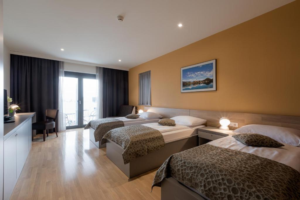 Postel nebo postele na pokoji v ubytování Hotel Florjančkov Hram