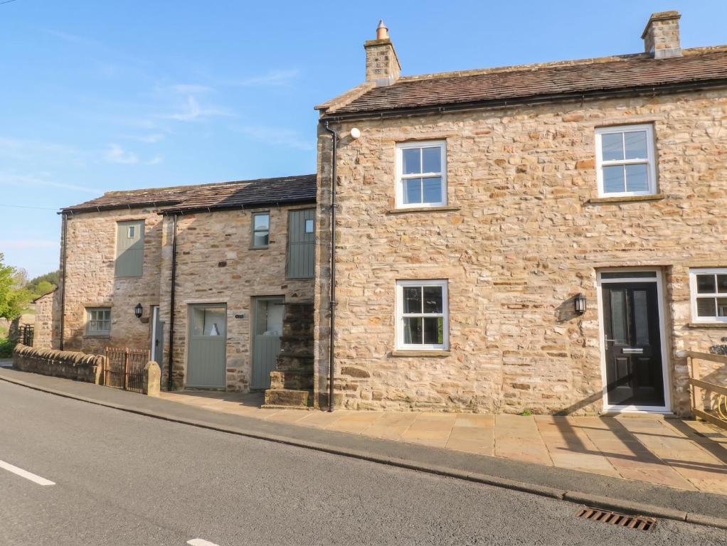 an old stone house on the side of a street at White Lea in Richmond