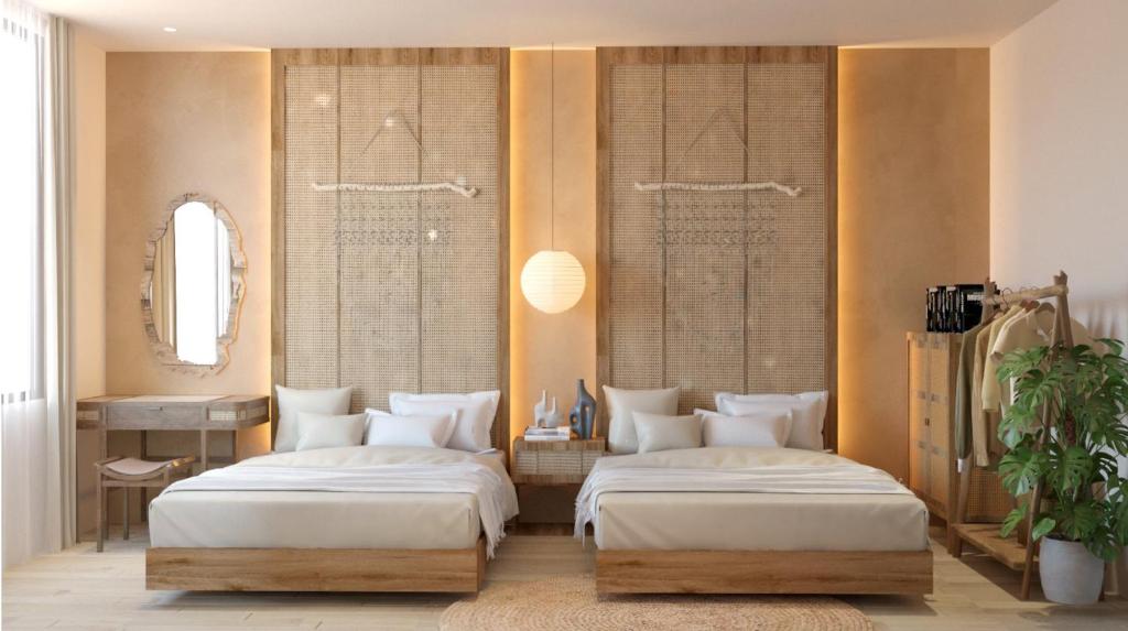 two beds in a room with two windows at Tổ Homestay in Thôn Kim Long (1)