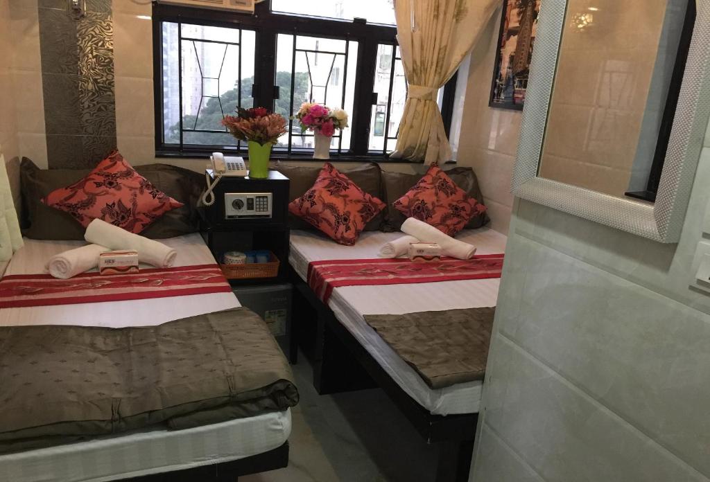 Postel nebo postele na pokoji v ubytování Skyview Hostel