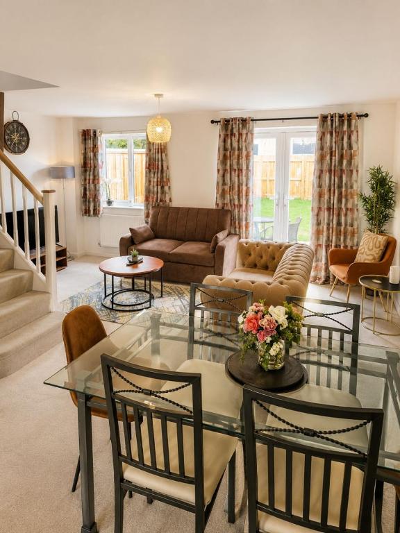 a living room with a glass table and chairs at Halton haven Three bed house sleeps 8 in Halton