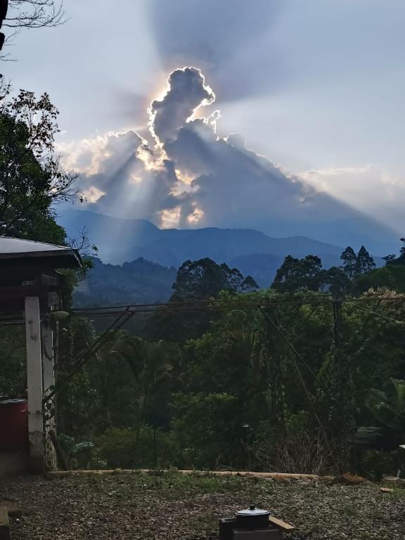 a cloud formation in the sky over the mountains at La Escondida in Jardin