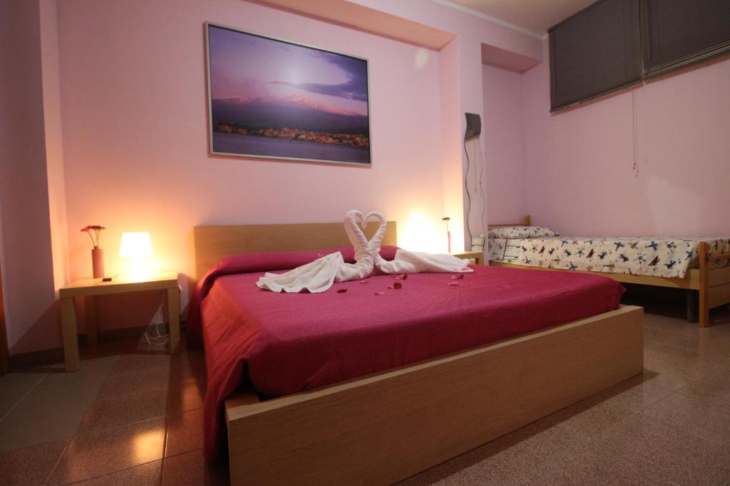 Postel nebo postele na pokoji v ubytování Nemi rooms