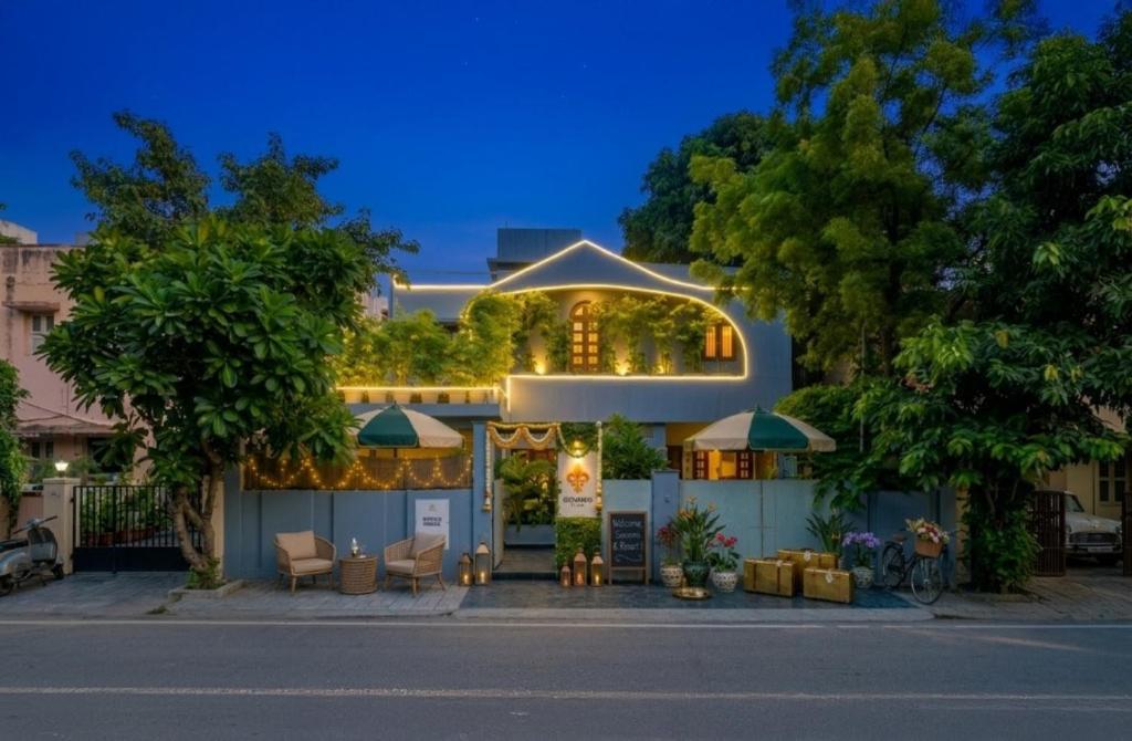 a house with lights on the side of it at Giovanni House in Bhopal
