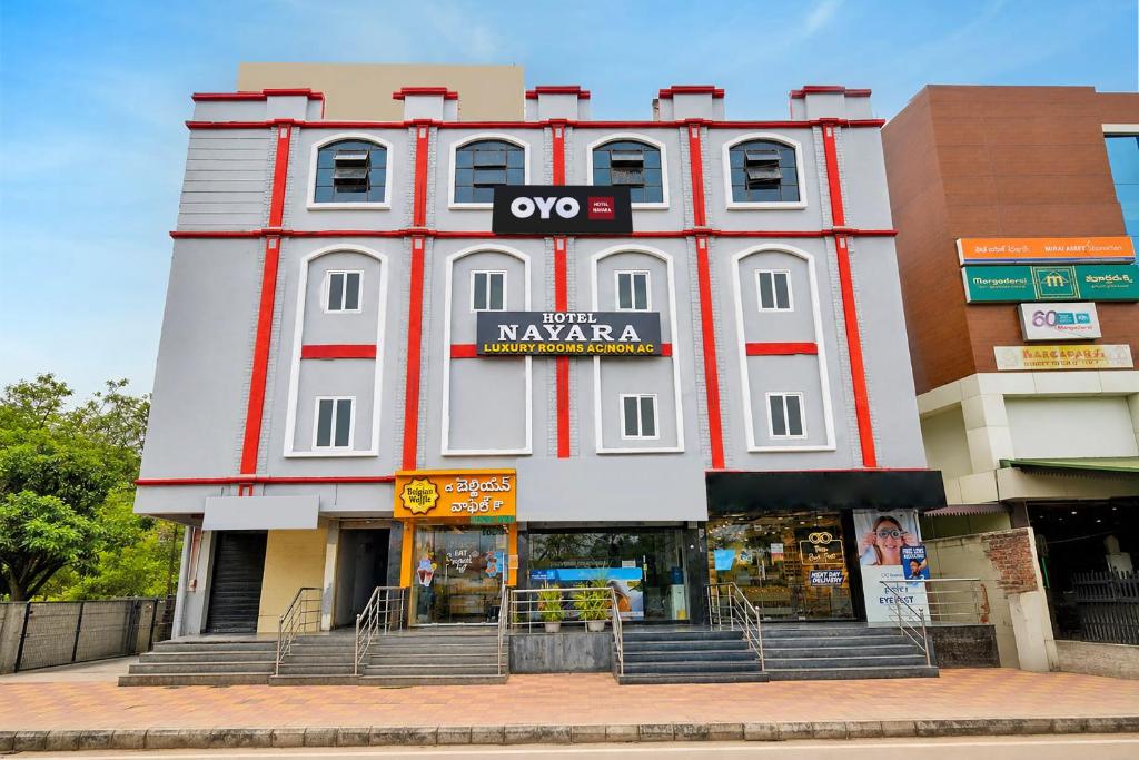 a large white building with a sign on it at HOTEL O NAYARA in Hyderabad