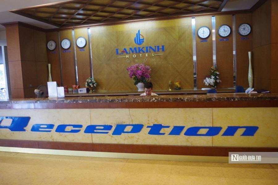 a reception counter in a hotel with clocks on the wall at Kother in Ho Chi Minh City