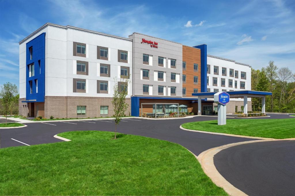 a rendering of a hotel with a building at Hampton Inn By Hilton Lawrenceburg in Lawrenceburg