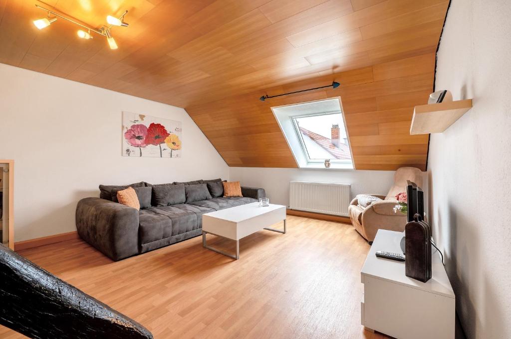 a living room with a couch and a table at Am Fabianstift 1 in Hornbach