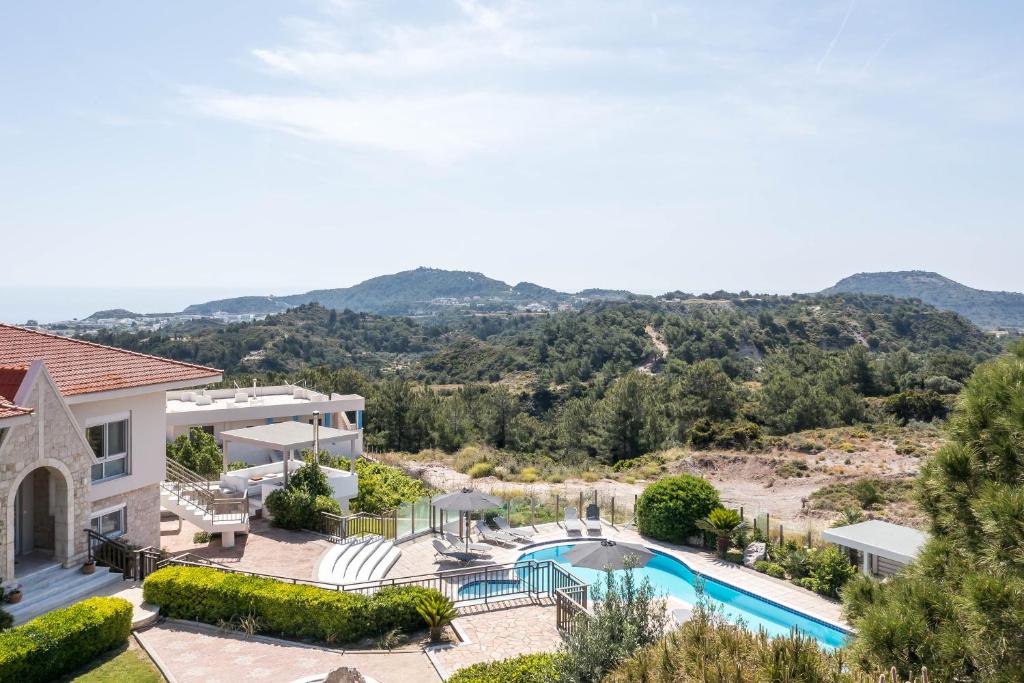 an aerial view of a villa with a swimming pool at Elysian View Estate in Faliraki