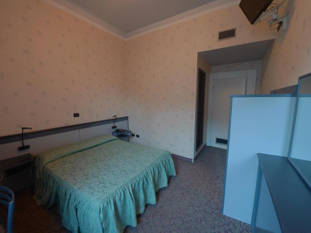 Postel nebo postele na pokoji v ubytování Hotel Ada