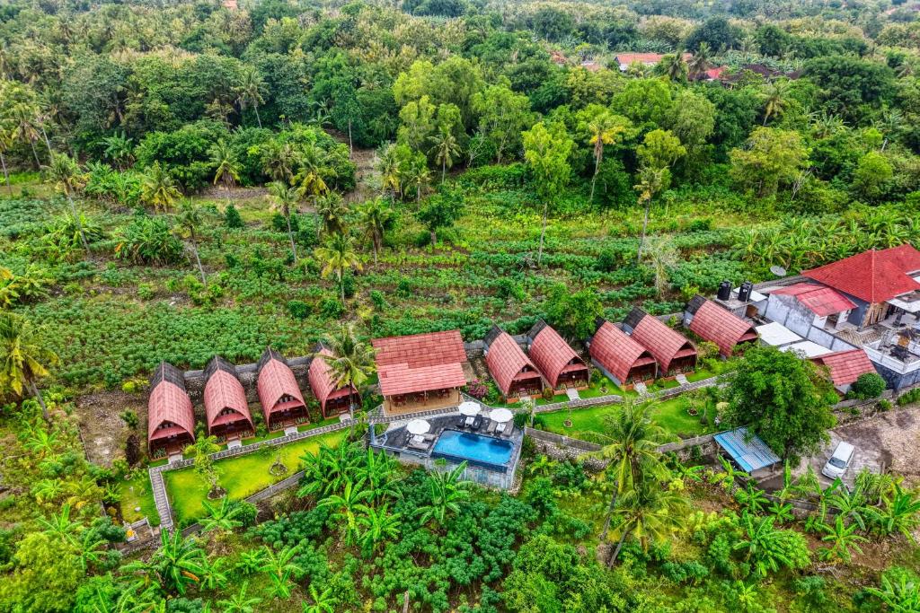 an overhead view of a group of houses with red roofs at Bunut Bungalow in Nusa Penida