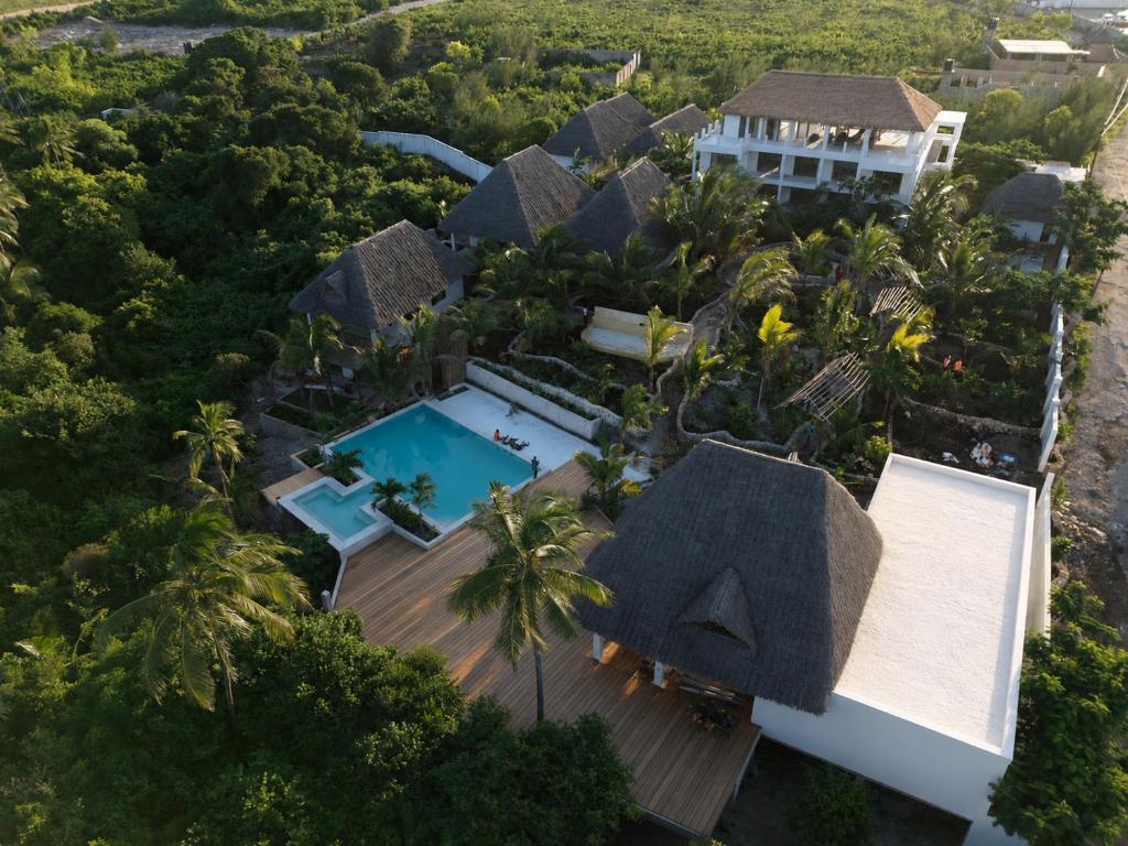 an aerial view of a resort with a swimming pool at Eco Resort WildLand - Zanzibar in Bwejuu