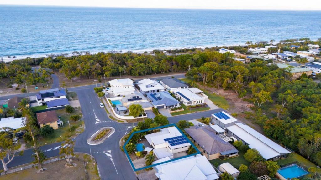 an aerial view of a home next to the ocean at Wave Whisperer Retreat in Woorim