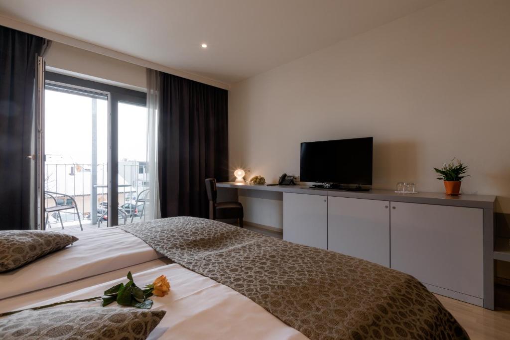 Postel nebo postele na pokoji v ubytování Hotel Florjančkov Hram