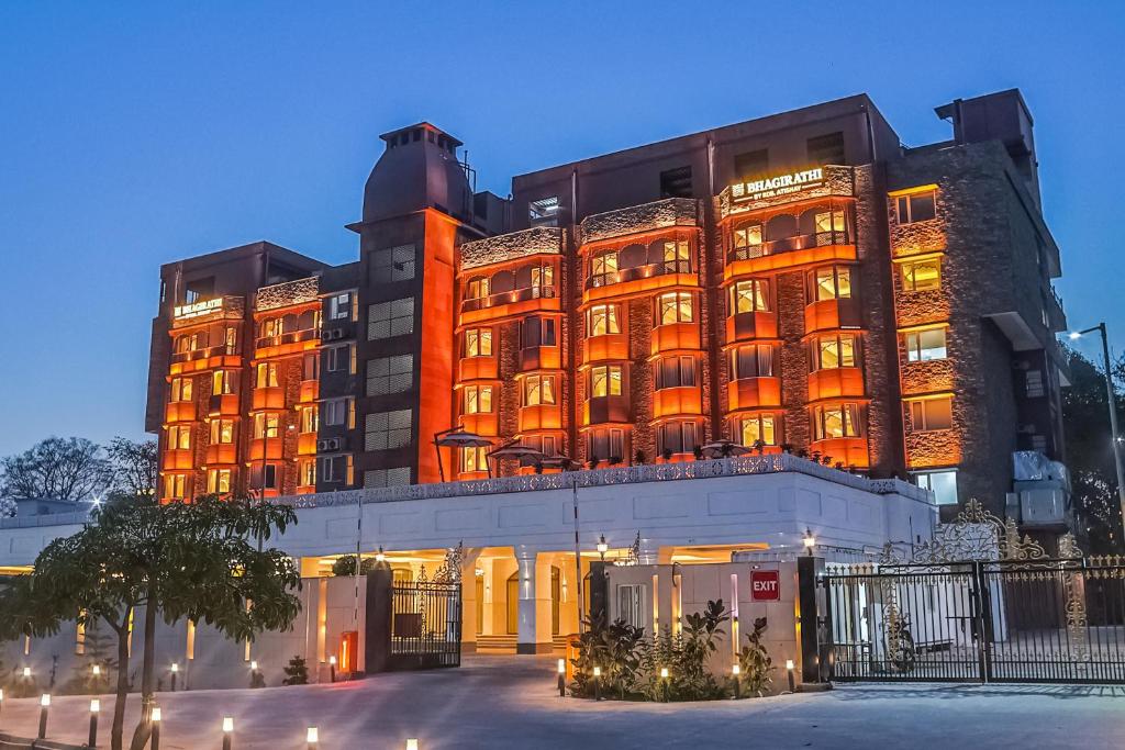 a large building with a lit up facade at Bhagirathi By Atishay in Haridwār